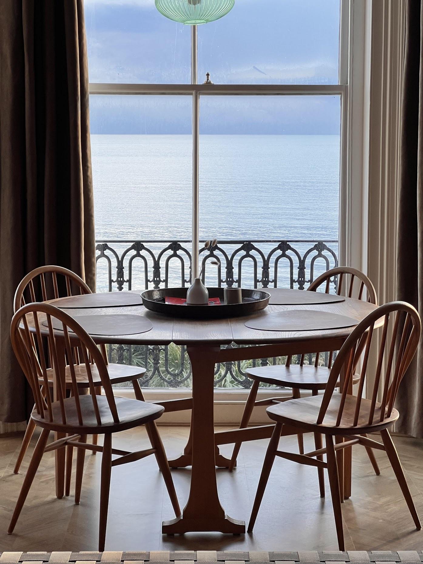 Round dining table against the sea view
