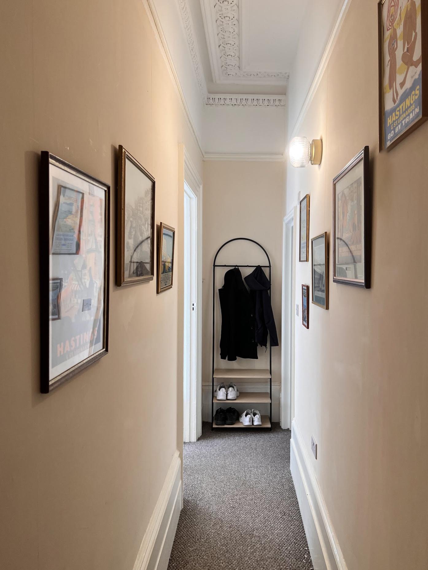 Hallway lined with framed prints