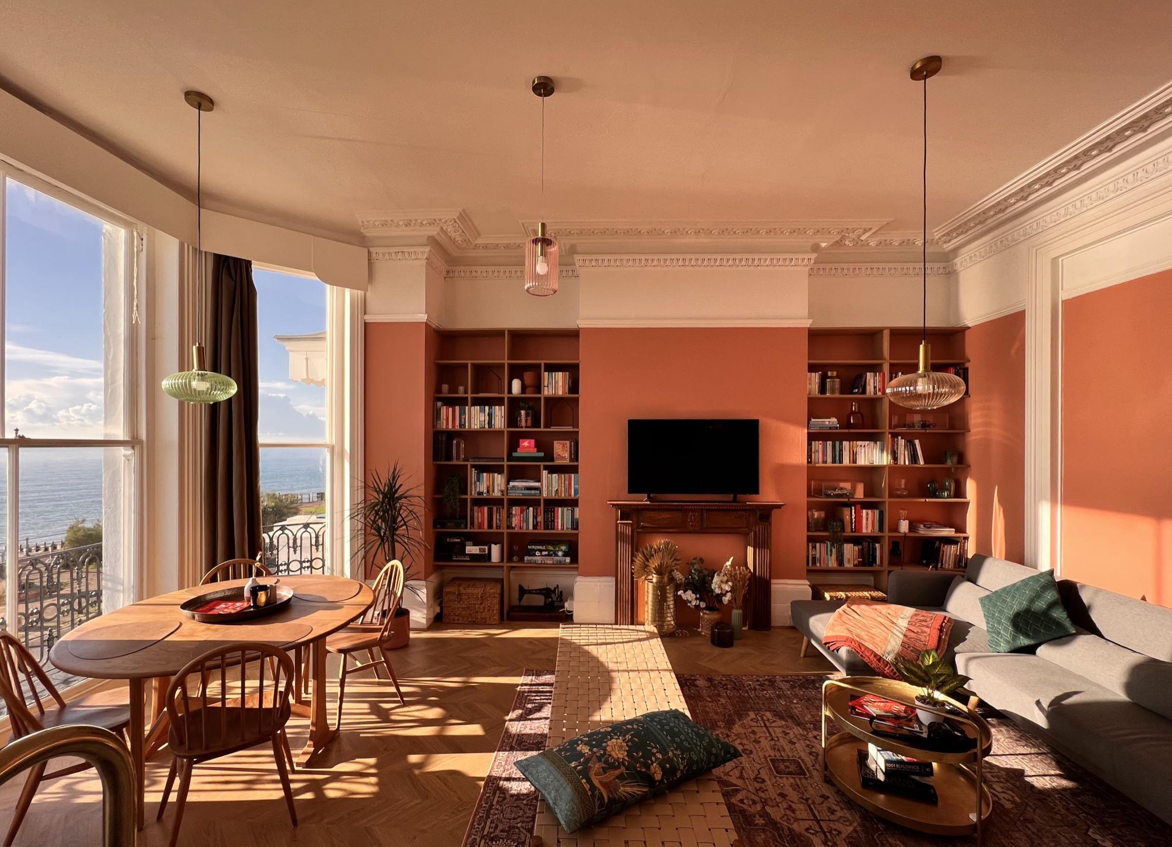 Living room with bookshelves in golden evening light
